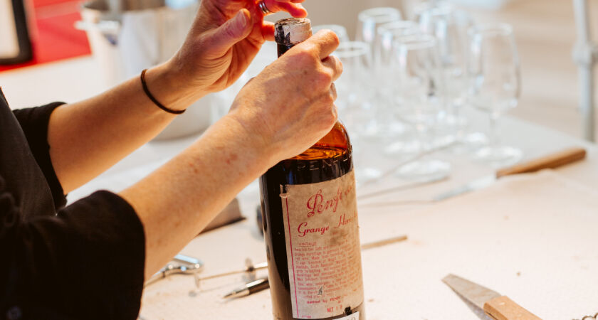 A bottle of Grange being opened at Penfolds Melbourne Re-corking Clinic